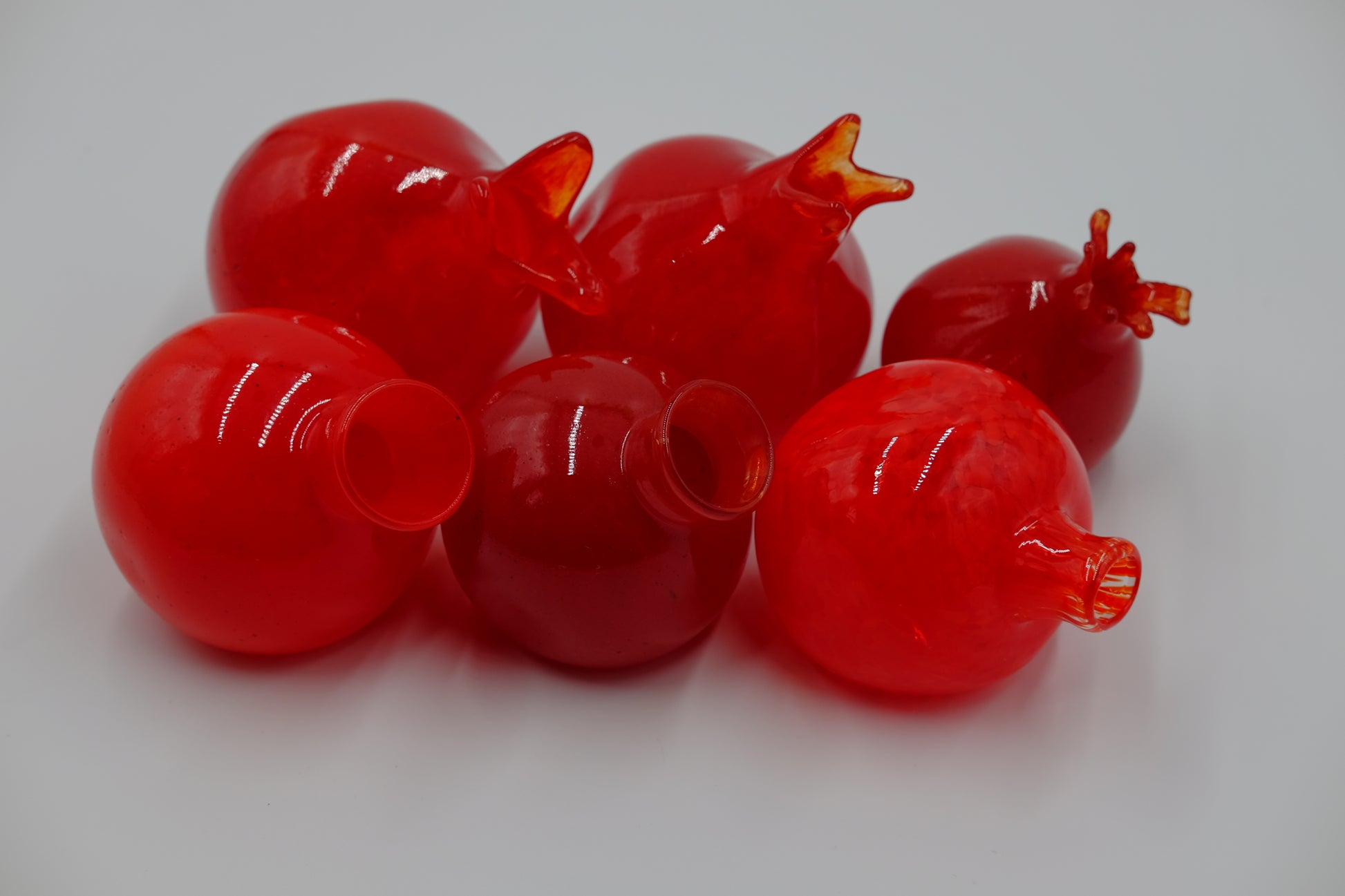 Hand Blown Pomegranate. Perfect for your living room, best in the light.  Roughly 4" x 4"