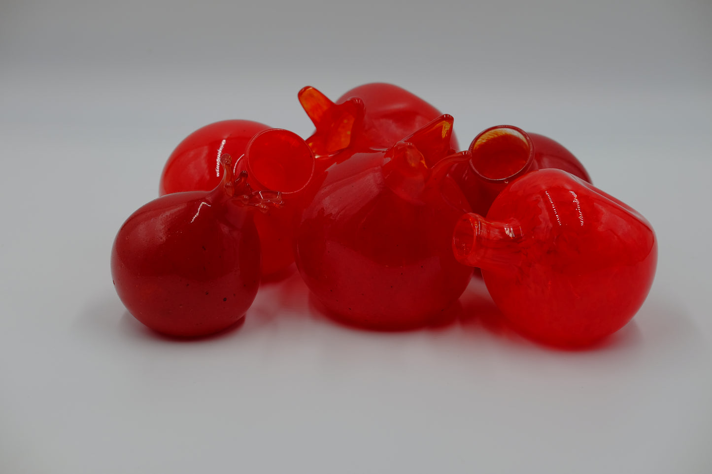 Hand Blown Pomegranate. Perfect for your living room, best in the light.  Roughly 4" x 4"